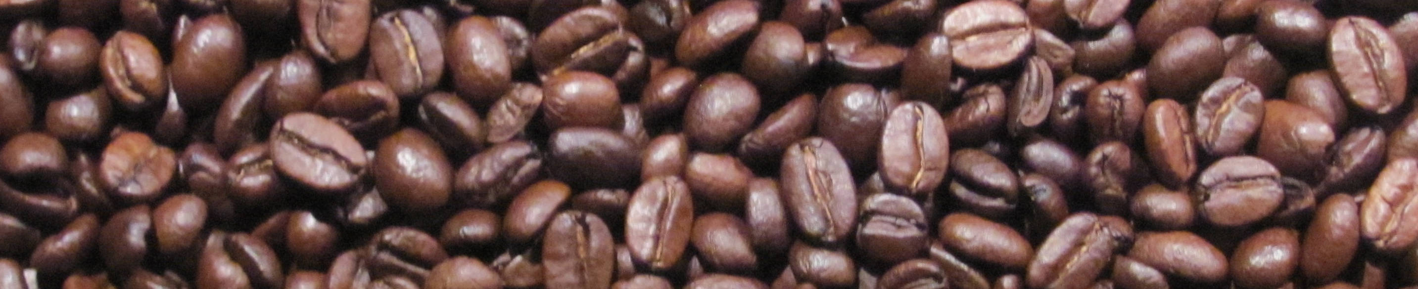Ein Bannerbild mit espresso bohnen